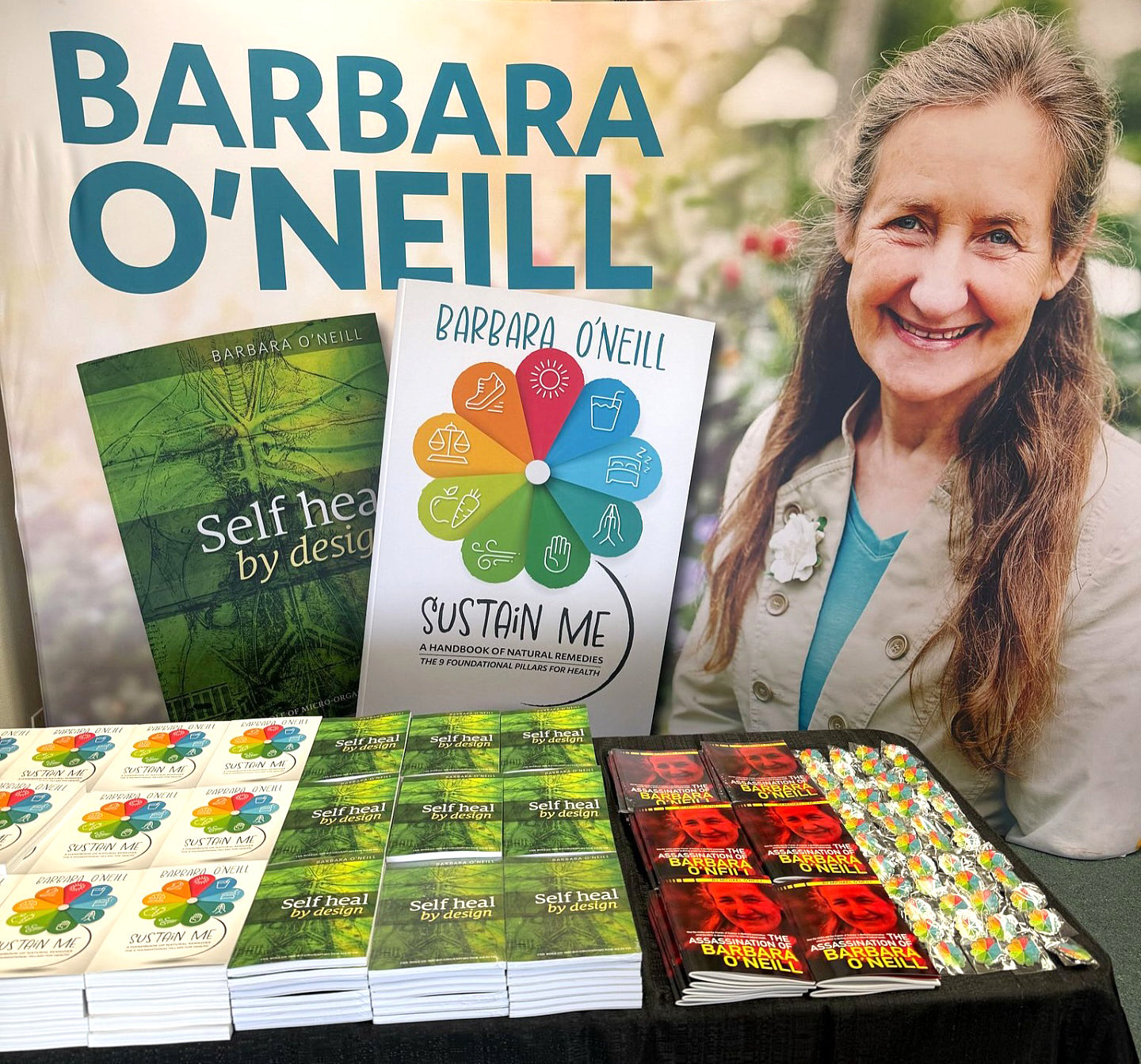 Display of Barbara O'Neill's books and products with an image of her smiling in the background.